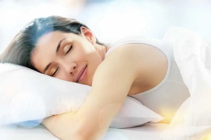 woman sleeping in bed on a pillow