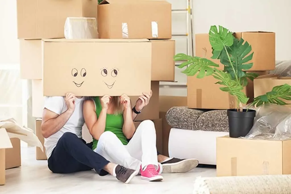 couple with boxes on their heads
