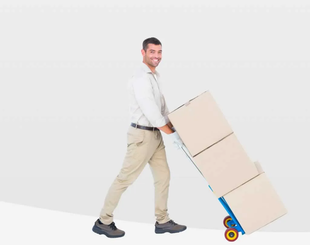 man pushing cart with moving boxes