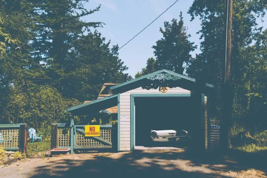 shed converted into a garage with workshop